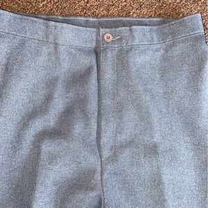 LEVI’S Bend Over polyester slacks with permanent crease and slim profile.